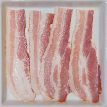 Bacon on white plate.の写真素材
