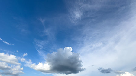 blue sky background with white clouds. Cumulus white clouds in the blue sky.