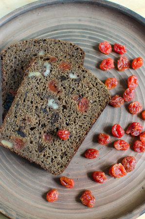 Homemade sourdough rye bread with dried fruit and nuts -kuraga, dried cherries, walnuts and...