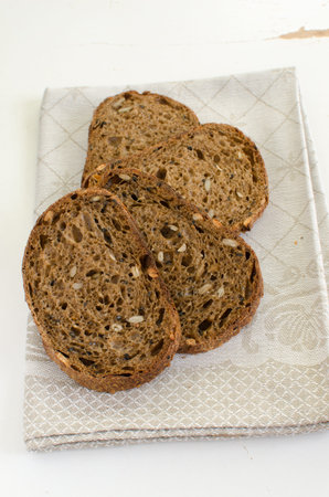 Homemade sourdough multigrain bread with sunflower, sesame and pumpkin seedsの写真素材