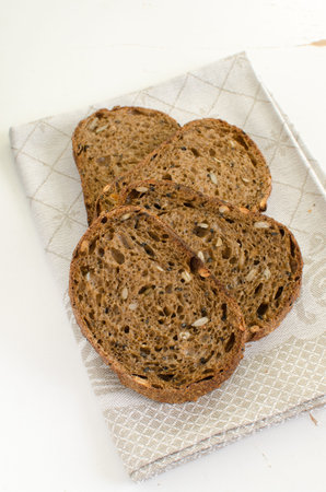Homemade sourdough multigrain bread with sunflower, sesame and pumpkin seedsの写真素材