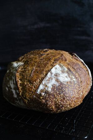 Homemade sourdough bread with wheat and rye flour, malt and coriander seedの写真素材