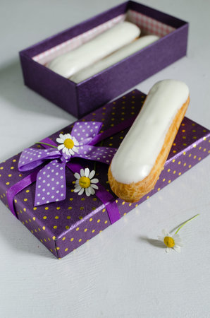 Homemade eclair with cream of cream cheese and blueberry coolieの写真素材