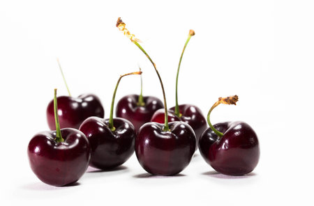 Many cherry fruit on white backgroundの写真素材