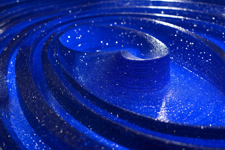 Blue abstract background with concentric lines and bokeh effect.の素材