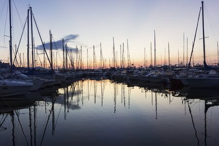 Boats anchored in the harbor in Antibes in Franceの写真素材