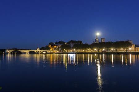 Full moon over Old Town in Avignon in Franceの写真素材