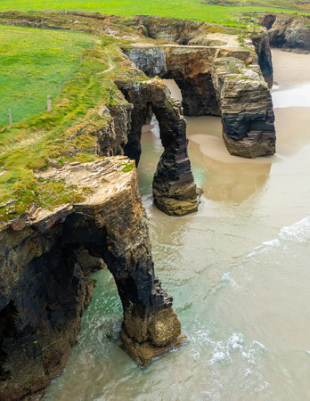 Natural rock arches Cathedrals beach, Playa de las Catedrales at Ribadeo, Galicia, Spainの写真素材