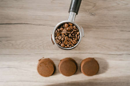 coffee beans in a holder, top view, recycled caffeine tablets, organic body care product, scrubの写真素材
