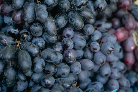 black grapes close up, fresh fruit market