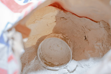 The concept of building materials. Finishing coat in the form of dry cement powder. selective focus, copy spaceの写真素材