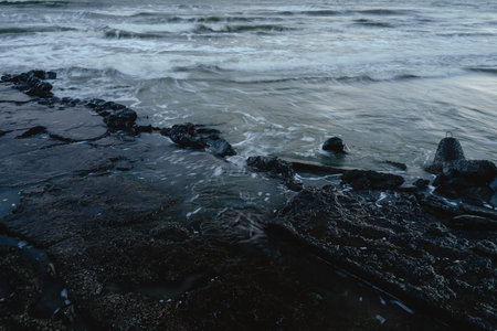 sea water on the stone coast, a dangerous place for swimmingの写真素材