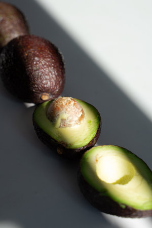ripe avocado lies on the tableの写真素材