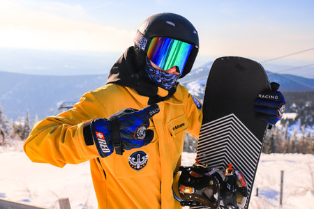 portrait of a snowboarder in a helmet and goggles on top of a mountain. Sheregesh 09.02.2023の写真素材