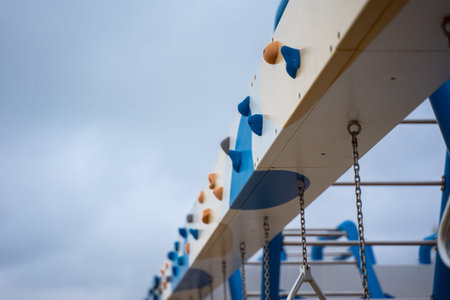 Close-up view of the side of a ship with blue and white sails