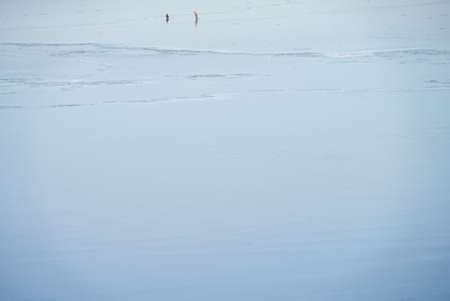 The concept of winter fishing. Fishermen on the ice. Winter fishing in Russiaの写真素材