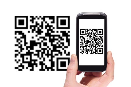 Scanning QR code with smart phoneの写真素材