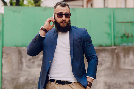 beard man with phoneの写真素材