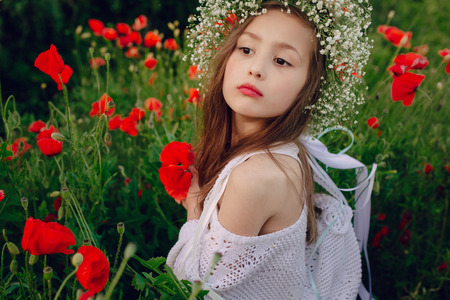 had a good girl at poppy wreath of flowersの写真素材