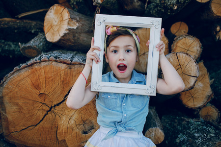 nice little model posing on a background of wooden beamsの写真素材
