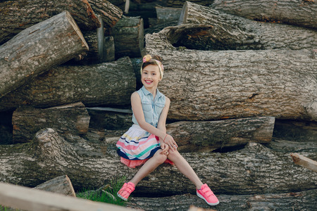 nice little model posing on a background of wooden beamsの写真素材