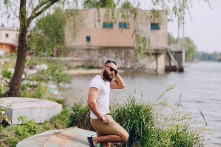 bearded man on the beach on summer dayの写真素材