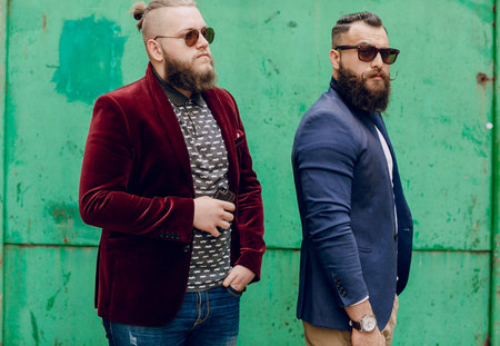 Two bearded men fashion outdoors on summer day