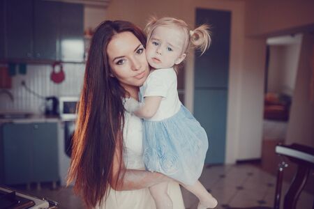 family happy young beautiful mother and little daughterの写真素材