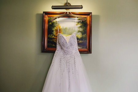 excellent expensive wedding dress hanging in the interiorの写真素材