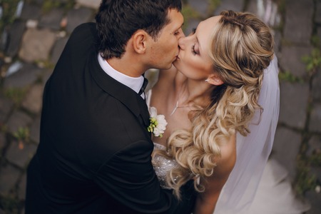 lovely wedding couple walking on their wedding dayの写真素材
