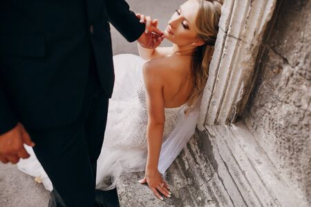 lovely wedding couple walking on their wedding dayの写真素材