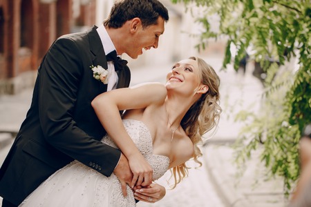 lovely wedding couple walking on their wedding dayの写真素材