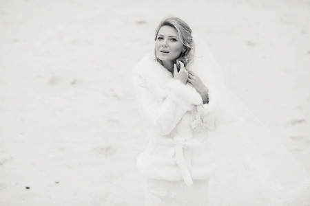 charming wedding couple celebrate their wedding day in Odessa winterの写真素材