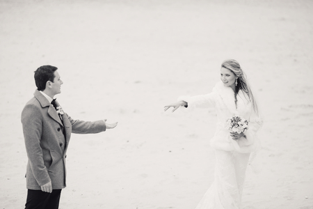charming wedding couple celebrate their wedding day in Odessa winterの写真素材