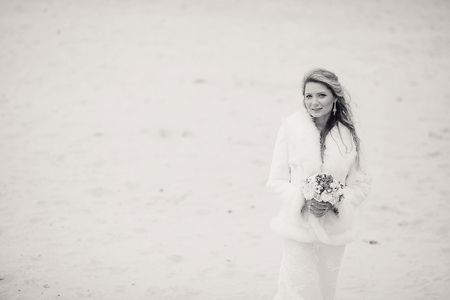 charming wedding couple celebrate their wedding day in Odessa winterの写真素材