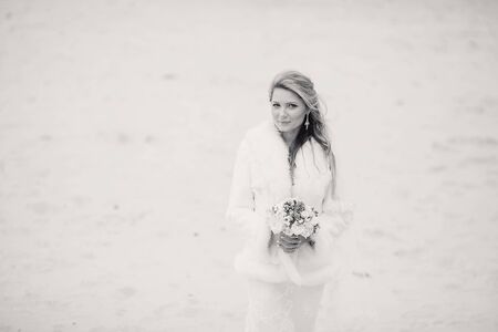 charming wedding couple celebrate their wedding day in Odessa winterの写真素材