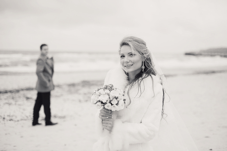 charming wedding couple celebrate their wedding day in Odessa winterの写真素材