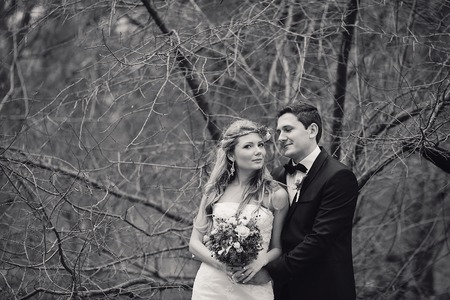 charming wedding couple celebrate their wedding day in Odessa winterの写真素材