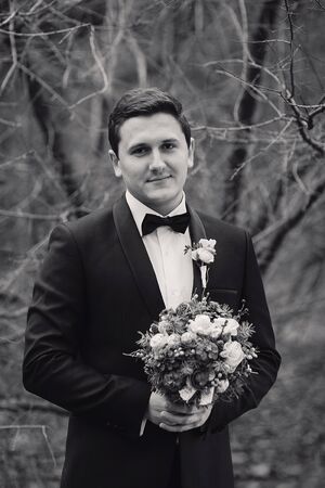 charming wedding couple celebrate their wedding day in Odessa winterの写真素材