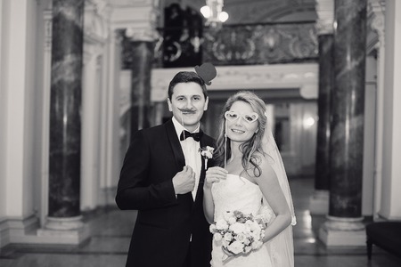 charming wedding couple celebrate their wedding day in Odessa winterの写真素材