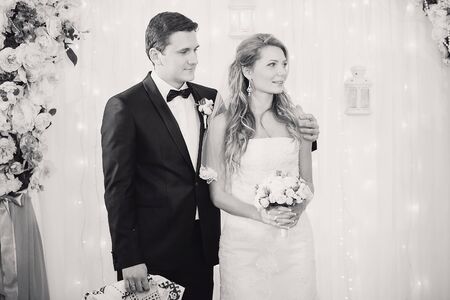 charming wedding couple celebrate their wedding day in Odessa winterの写真素材