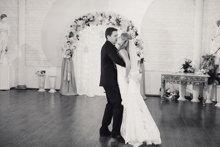 charming wedding couple celebrate their wedding day in Odessa winterの写真素材