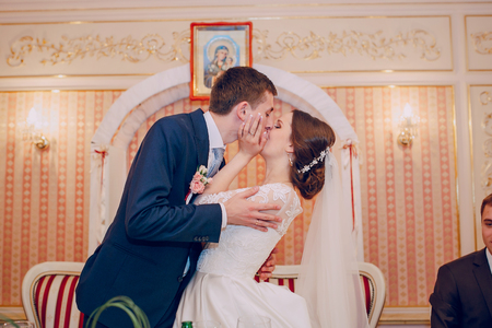 beautiful wedding couple on their wedding in a restaurantの写真素材