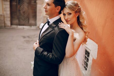 lovely wedding couple walking on their wedding dayの写真素材