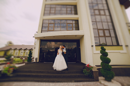 lovely wedding couple walking on their wedding dayの写真素材