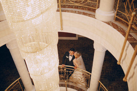 Wedding couple in the elegant interior of the hotelの写真素材