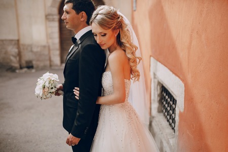 lovely wedding couple walking on their wedding dayの写真素材