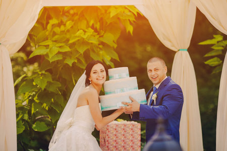 beautiful young couple in wedding sunny summer dayの写真素材