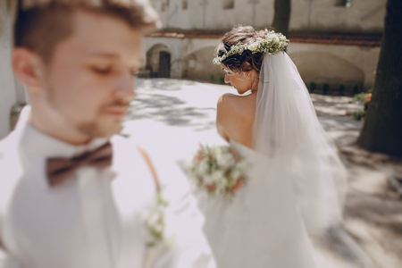 lovely wedding couple oditi a crown of butterflies and suspendersの写真素材
