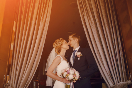 lovely blond summer wedding couple in sunny weatherの写真素材